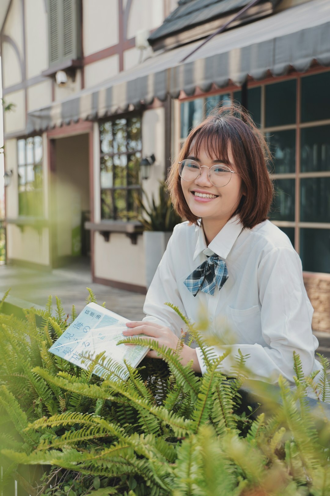 Japanese woman financial analyst smiling in business attire