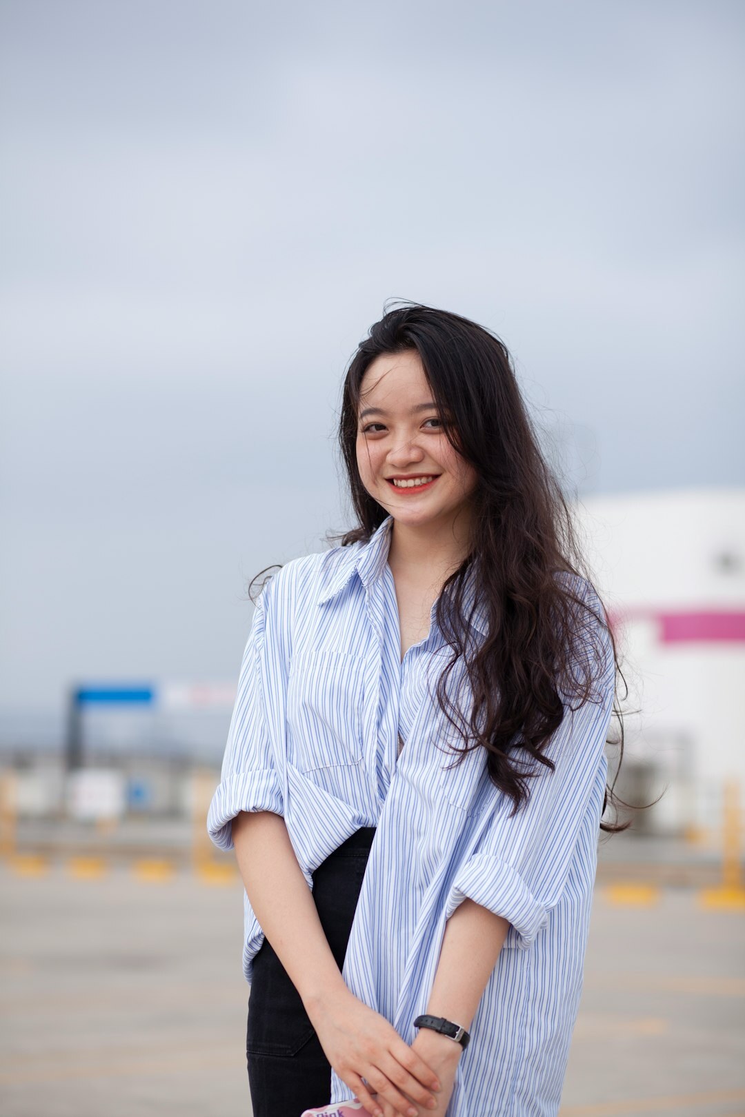 Japanese woman office worker smiling in casual business attire