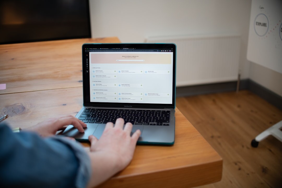 person tracking expenses on laptop